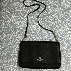 Kate Spade cross body bag. Black with gold chain link on side of strap.